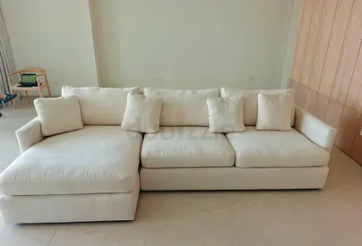 Excellent condition like new crate and barrel beige color lshape sofa