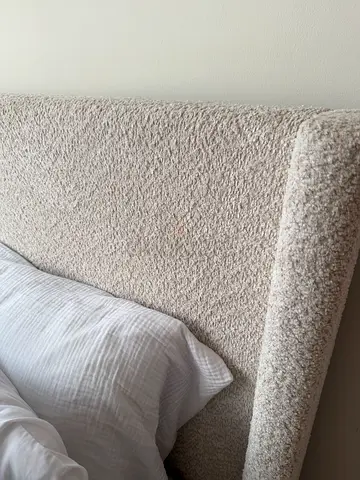 Beige boucle queen bed with mattress