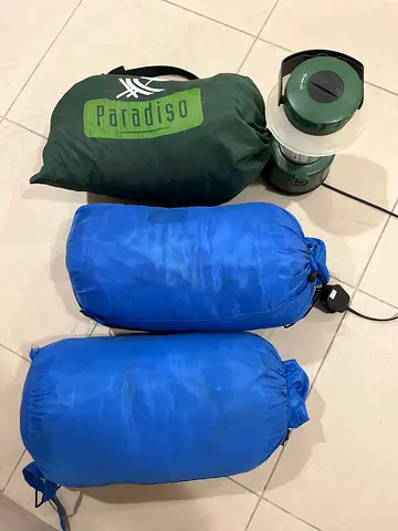 Two sleeping bags + camping lantern + blow up bean bag good used condition
