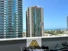 Own a one-bedroom apartment for sale in cash in Ajman One Towers with a sea view, practical features