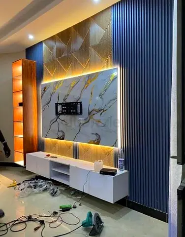 Modern wall-mounted entertainment unit with LED backlit marble panel and shelving