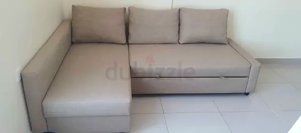 Grey L-Shaped Sofa Bed with storage Excellent condition