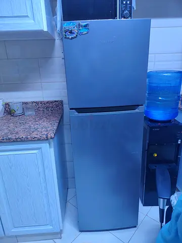 Silver two-door refrigerator in good working condition (Hisense)