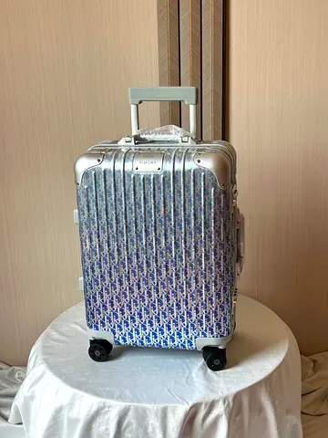 Dior and Rimowa suitcase