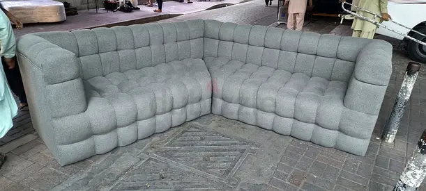 L-shaped tufted grey fabric corner sofa — good condition