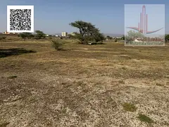 Residential land in Manama, 8-plot corner lot on two streets, prime location close to all services -