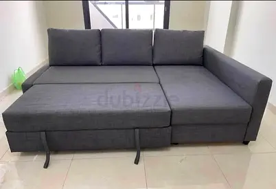 Gray L-shaped Sofa Bed with Storage — Good Condition