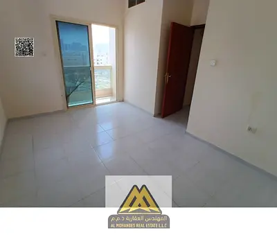 1BR in Al Rashidiya 2, balcony, central AC, family building, free maintenance, AED 26K, 6 payments.