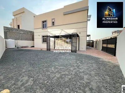 Villa for sale in Al Zahia; land area 5,300 sq. ft. Features 6 bedrooms and an external annex. Includes electricity, water, and air conditioning; free