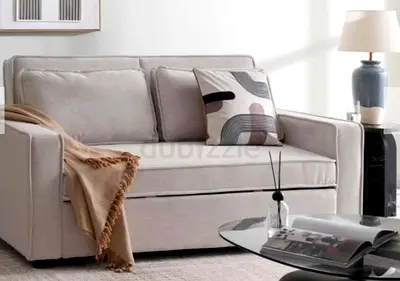 Off white 2-seater sofa cum bed - compact and clean condition