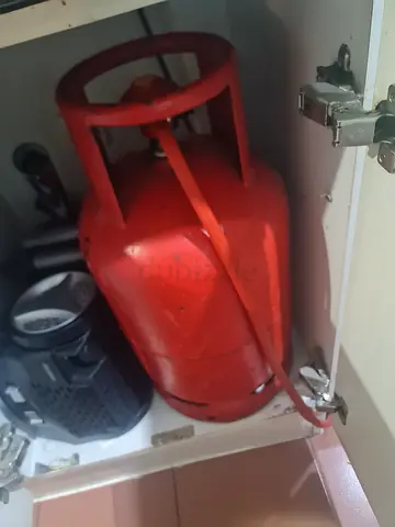 Small red LPG gas cylinder for kitchen — used, good condition