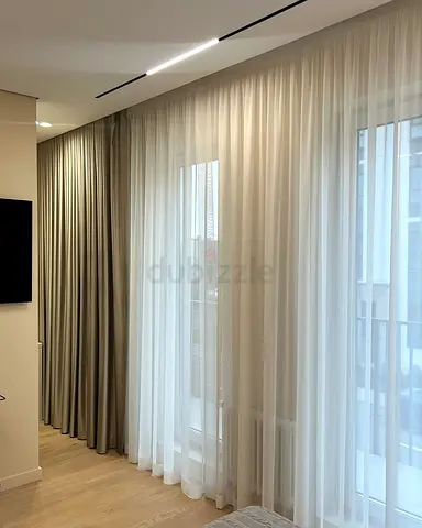 Full-length beige curtains with sheer white voile panels - set