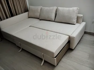 Light beige L-shaped pull-out sofa bed, good condition