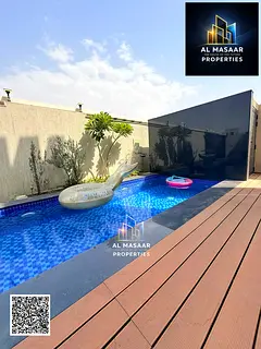 Villa for rent in Al Bahia, Ajman, featuring a private pool and ready for immediate occupancy. Strat