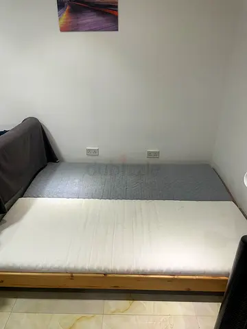 Single size wooden frames with mattresses - convertible to sofa or queen size bed - good condition