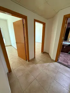 Spacious 2-Bedroom Apartment with Living Room in Al Majaz 2, featuring a direct side lake view. A gr