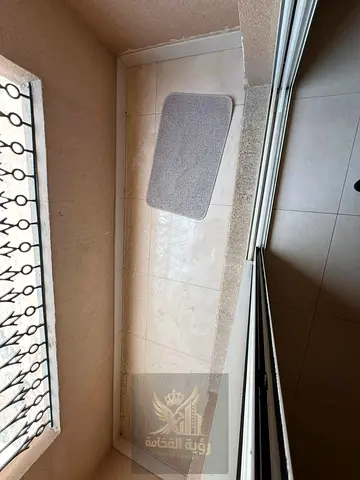 One bedroom and living room in Al Butina with balcony bathroom and central AC Annual rent 28000 in 4 or 6 payments six month deferred deposit plus one