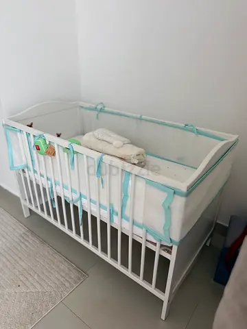 White Baby Crib with Light Blue Bumper - Good Condition with matress