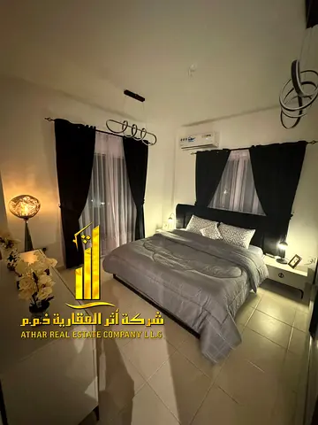 Cheapest two-bedroom apartment in Ajman - Al Rawda 3 - Sheikh Ammar Street - furnished with high-end furniture for monthly rent