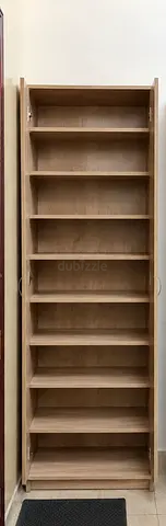 Tall wooden storage cabinet with multiple shelves - good condition