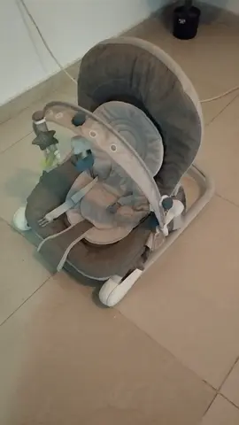 Gently used baby rocker/bouncer with toy bar and recline