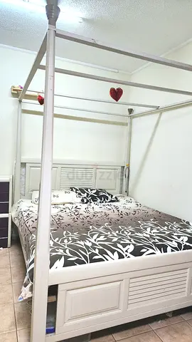 White Four-Poster Double Bed with Headboard and Canopy Frame with a brand new unused bed