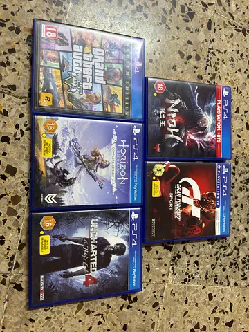 Play Station 4 with 2 controllers and games