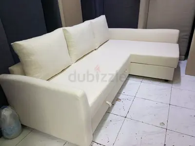 Cream L-Shaped Sofa Bed with Pull-Out Section