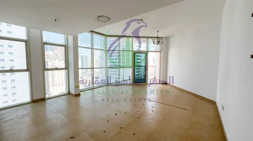 شقة 3 غرف وصالة للإيجار في التعاون | برج حديث | إطلالات بانورامية | 67,000 درهم