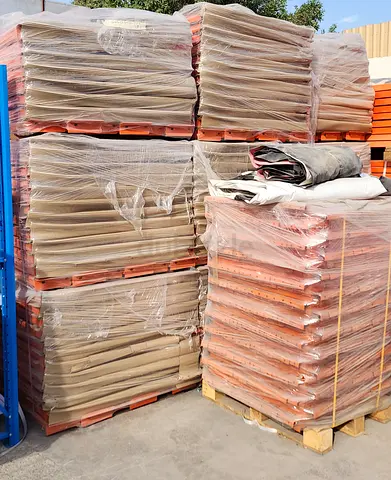 Bulk orange shelves stacked - good condition