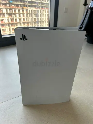 Sony PlayStation 5 with 2 controllers and 3 games