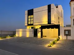 A villa on the main street, ready to move into, in one of Ajman's most prestigious areas. Freehold o