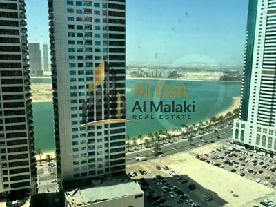2-Bedroom Apartment for Annual Rent in Al Khan, Sharjah, featuring 2 Bathrooms, Central AC, Free Gym and Swimming Pool, with a Comfortable Layout in a
