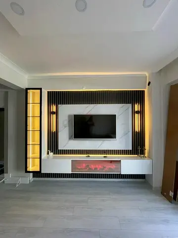 Modern built-in TV entertainment unit with LED lighting and electric fireplace