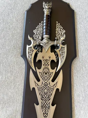 Decorative ornate fantasy wall sword on plaque