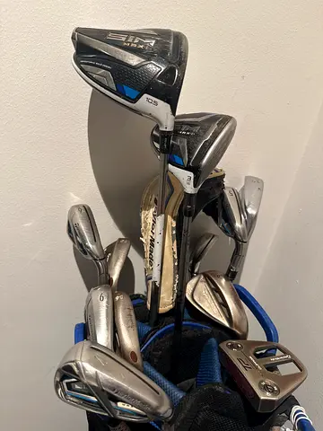 Used set of TaylorMade & mixed golf clubs with bag