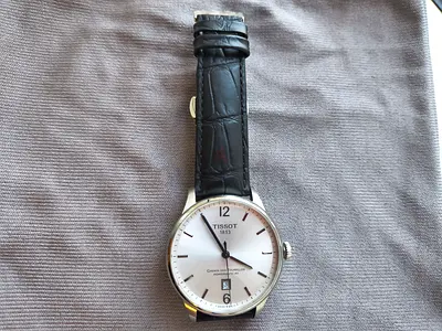 Tissot Chemin Des Tourelles Powermatic 80 -T099407A series with a silver face and leather strap