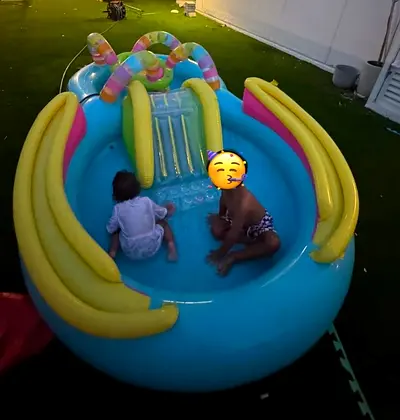 Inflatable Child Splash Pool with Slide and Play Arch - Gently Used.