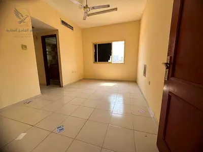 One bedroom and living room in Al Rashidiya 2, Ajman, payable in 6 installments. Features a balcony and central air conditioning. Located behind Falco
