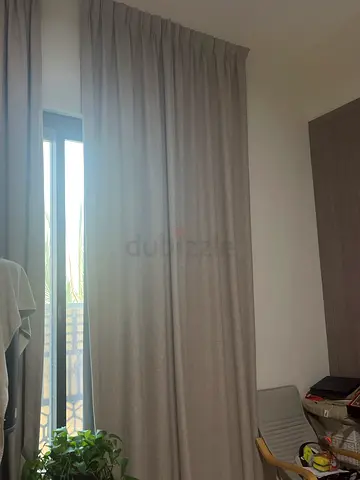 Neutral grey Floor Length Curtains with the railing