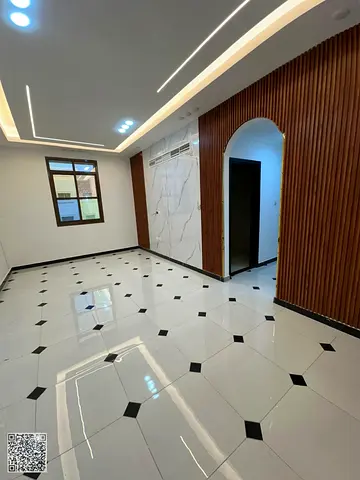 Luxurious two-bedroom apartment with a living room for annual rent in Rawda 3, including two bathrooms and very high-end finishing.