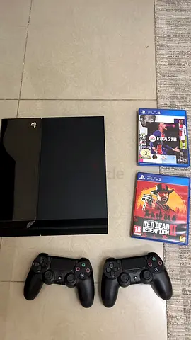 PlayStation 4 with 2 DualShock controllers + 2 games (Good working condition)URGENT SALE