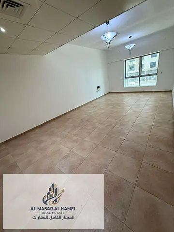 Spacious one-bedroom apartment with a comfortable living room in Al Majaz, located in a prime and c