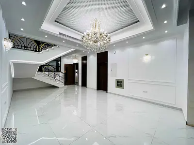 Luxury classic villa with five master bedrooms, maid's room, and a pool for sale in Ajman – Al Helio 2