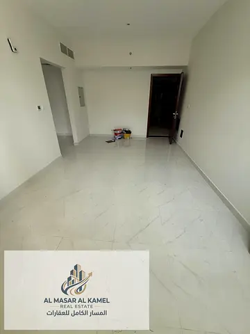 A distinctive one-bedroom apartment for rent in Al Taawun, featuring an excellent size and a beautiful open view. Located in a vibrant area close to a