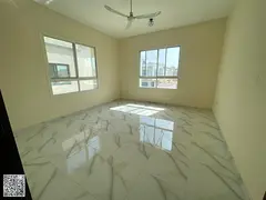 A luxurious villa in Al Yasmin, available for annual rent. It boasts a very spacious area, a maid's