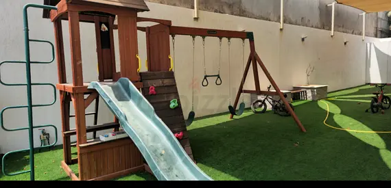 Wooden Outdoor Playset with Slide, Swings and Climbing Wall - Good Condition