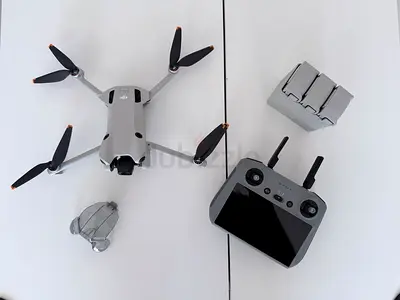 DJI Mini 4 Pro series foldable drone with controller and extra batteries - used once
