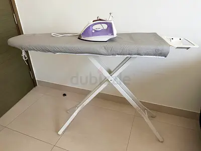 Ironing board with steam iron - good condition