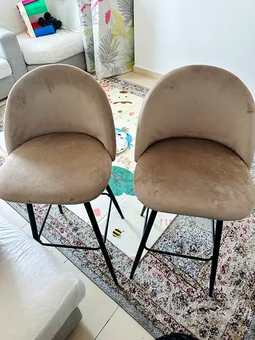 2 beige color high chairs